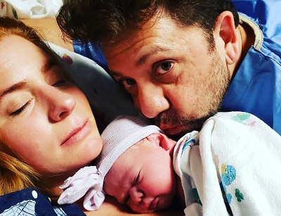 Yeomans sharing the moment of love with her husband Jesse Salazar and her newly born baby